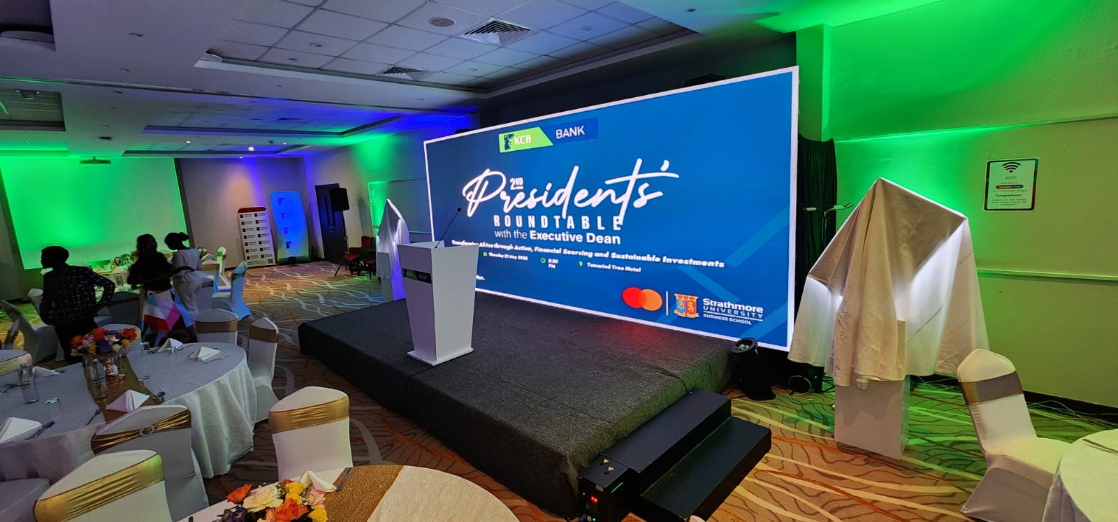 KCB Bank Presidents Roundtable stage with LED screen and uplighting at Tamarind Tree Hotel Nairobi