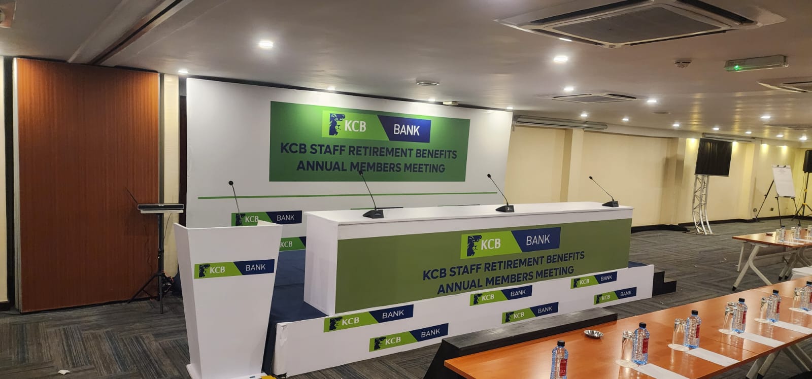 KCB Bank Staff Retirement Benefits Annual Members Meeting stage and branded head table in Nairobi