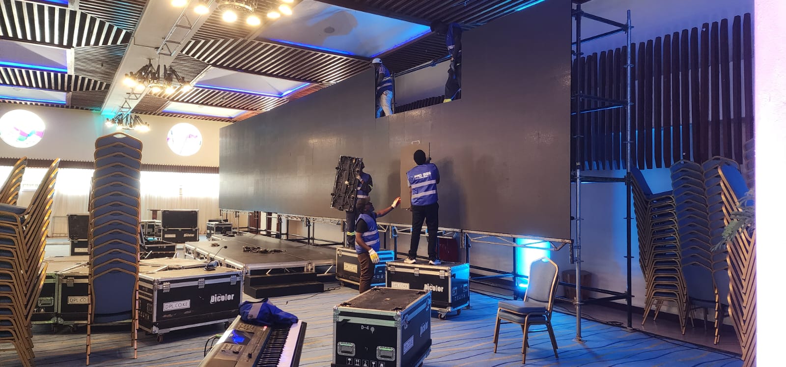 Progigs Audio Visual crew installing LED wall panels during an event build in Nairobi