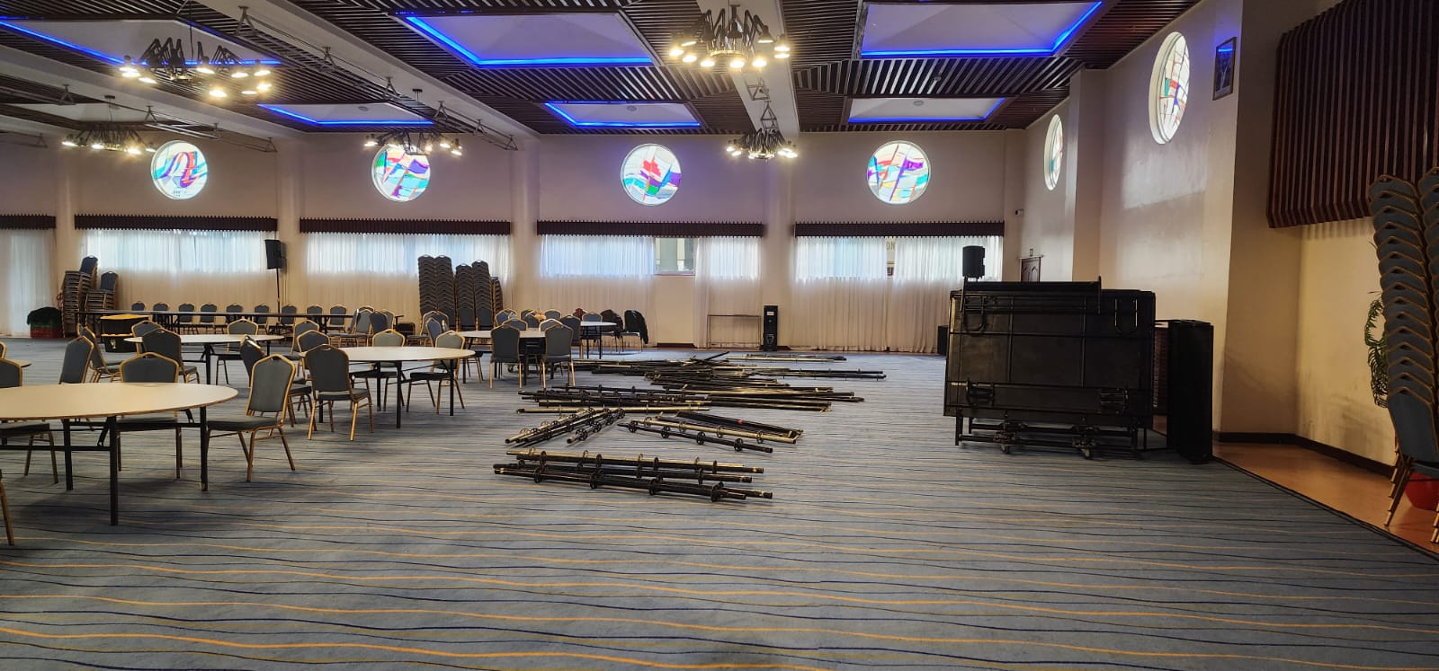 Venue preparation with lighting truss and staging laid out before an event in Nairobi