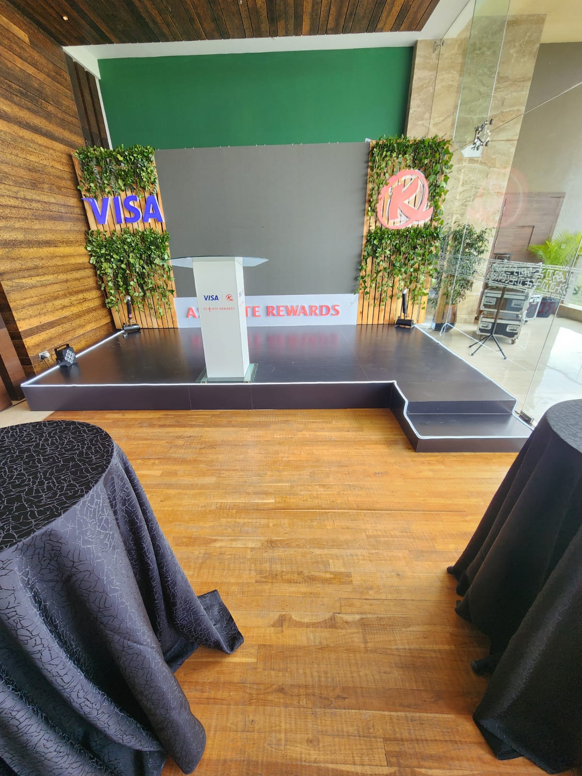 VISA and Asante Rewards launch stage with living plant walls and glass podium in Nairobi
