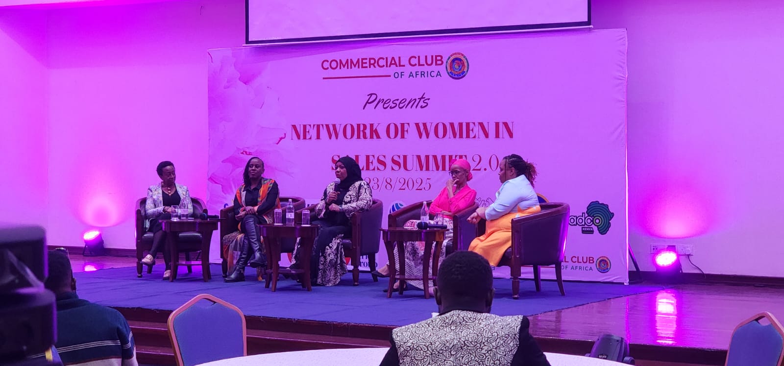 Commercial Club of Africa Network of Women in Sales Summit panel stage with circular LED ring lighting in Nairobi